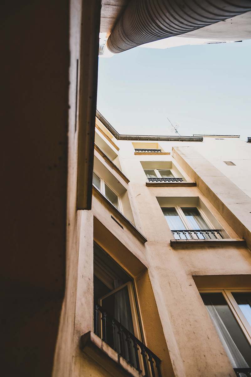 window low angle view of apartment complex curtain